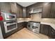 Updated kitchen with stainless steel oven, microwave, white countertops, and stone backsplash at 302A 32Nd Ave. N, North Myrtle Beach, SC 29582