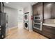 This well-appointed kitchen has appliances, dark cabinets, with a laundry center at 302A 32Nd Ave. N, North Myrtle Beach, SC 29582