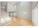 Living room with high ceilings, large windows, and lots of natural light; includes staircase at 302A 32Nd Ave. N, North Myrtle Beach, SC 29582