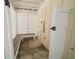 Outdoor shower under an elevated beach home featuring a bench and neutral decor at 302A 32Nd Ave. N, North Myrtle Beach, SC 29582