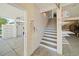 A view of a staircase leading to a higher level, with a view of the outdoors and other storage at 302A 32Nd Ave. N, North Myrtle Beach, SC 29582