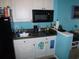 Efficient kitchenette featuring mini fridge, microwave, sink, and compact countertop space at 6803 N Ocean Blvd. # 210, Myrtle Beach, SC 29572