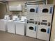 Multiple washers and dryers available for residents in the laundry room at 6803 N Ocean Blvd. # 210, Myrtle Beach, SC 29572