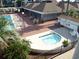 Community amenities include swimming pool and hot tub surrounded by lounge chairs and manicured landscaping at 6803 N Ocean Blvd. # 210, Myrtle Beach, SC 29572