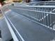Close-up of the accessible ramp, highlighting the metal railings and concrete pathway at 6803 N Ocean Blvd. # 210, Myrtle Beach, SC 29572