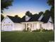 Charming house exterior with a front porch, and a well-manicured lawn and garden at Tbd Fries Bay Rd., Loris, SC 29569