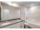 Modern bathroom with double vanity, granite countertop, and a tub/shower combo, offering style and functionality at 109 Arrow Wood Dr, Conway, SC 29526