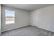 Comfortable bedroom with soft carpeting, neutral walls, and a bright window, creating a peaceful retreat at 109 Arrow Wood Dr, Conway, SC 29526