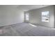 Spacious bedroom featuring neutral walls, carpet, and natural light, creating a serene atmosphere at 109 Arrow Wood Dr, Conway, SC 29526