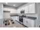 Modern kitchen with stainless steel appliances, granite counters, and white cabinetry at 109 Arrow Wood Dr, Conway, SC 29526