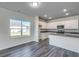 Open-concept kitchen with island seating and plenty of natural light at 109 Arrow Wood Dr, Conway, SC 29526