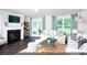 Bright living room with fireplace, neutral tones, and access to the backyard at 109 Arrow Wood Dr, Conway, SC 29526