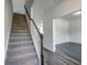 Stairway with gray carpet and white railings that leads to an open hallway at 109 Arrow Wood Dr, Conway, SC 29526