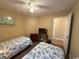 Twin bedroom with dresser, television and a window for natural light at 1095 West Plantation Dr. # 28-I, Little River, SC 29566