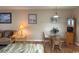 Cozy dining area with a glass table, wooden chairs, and beach-themed artwork on the walls at 1095 West Plantation Dr. # 28-I, Little River, SC 29566