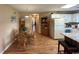 Open-concept living space with dining area, kitchen, and a hallway leading to other rooms at 1095 West Plantation Dr. # 28-I, Little River, SC 29566