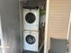 Stackable washer and dryer set in a closet offering efficient laundry solutions at 1095 West Plantation Dr. # 28-I, Little River, SC 29566