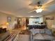 Open concept living room featuring comfortable seating, a dining area, and a kitchen with a breakfast bar at 1095 West Plantation Dr. # 28-I, Little River, SC 29566