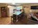 Open-concept living space including a kitchen with breakfast bar, living room, and dining area for comfortable living at 1095 West Plantation Dr. # 28-I, Little River, SC 29566