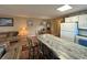 Open-concept living space with a breakfast bar, dining area, and comfortable seating for relaxing or entertaining at 1095 West Plantation Dr. # 28-I, Little River, SC 29566