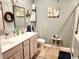 Bathroom with double sink vanity, framed mirrors, and tiled floor at 2256 Heritage Loop # 2256, Myrtle Beach, SC 29577