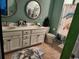Bathroom with double vanity, white cabinets, and a turtle-themed shower curtain and decor at 2256 Heritage Loop # 2256, Myrtle Beach, SC 29577