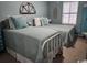Bedroom with two twin beds, soft blue bedding, and decorative wall art at 2256 Heritage Loop # 2256, Myrtle Beach, SC 29577