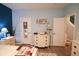 Bedroom with a neutral palette, wood floors, and a view into another room via a mirrored door at 2256 Heritage Loop # 2256, Myrtle Beach, SC 29577