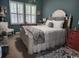 Comfortable bedroom featuring a well-lit space with shuttered windows, complemented by chic decor and warm ambiance at 2256 Heritage Loop # 2256, Myrtle Beach, SC 29577