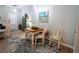 Cozy dining area with a wooden table set on a blue rug, creating a charming and inviting space at 2256 Heritage Loop # 2256, Myrtle Beach, SC 29577