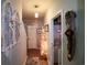 Hallway with Christmas decor, rustic wall accents, and an open laundry area at 2256 Heritage Loop # 2256, Myrtle Beach, SC 29577
