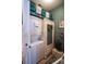 Efficient laundry area with a stacked washer and dryer, storage options, and stylish decor, enhancing functionality at 2256 Heritage Loop # 2256, Myrtle Beach, SC 29577