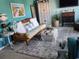 Living room with a daybed, coastal artwork, and eclectic decor elements at 2256 Heritage Loop # 2256, Myrtle Beach, SC 29577