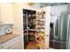Walk-in pantry with organized shelving, maximizing storage space for an efficient and tidy kitchen area at 2256 Heritage Loop # 2256, Myrtle Beach, SC 29577