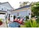Inviting outdoor patio space with pink chairs, blue rug, and charming decor near the home's exterior at 2256 Heritage Loop # 2256, Myrtle Beach, SC 29577