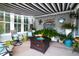 Relaxing sunroom featuring comfortable seating, a fire pit, and vibrant decor at 2256 Heritage Loop # 2256, Myrtle Beach, SC 29577