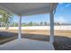 Covered patio with backyard and white vinyl fence providing both shade and privacy at 2469 Campton Loop, Conway, SC 29527