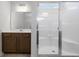 Bathroom with a single sink vanity, large mirror, and a glass enclosed walk-in shower at 2469 Campton Loop, Conway, SC 29527