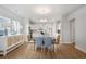 Bright dining room features hardwood floors and leads into the modern kitchen at 2469 Campton Loop, Conway, SC 29527