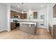Bright kitchen features stainless steel appliances, white countertops, and a kitchen island at 2469 Campton Loop, Conway, SC 29527