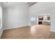 Spacious living area with hardwood floors and a partial view of the modern kitchen at 2469 Campton Loop, Conway, SC 29527