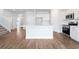 Modern kitchen showcasing white cabinets, stainless appliances, and hardwood floors at 2480 Campton Loop, Conway, SC 29527