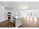 Bright, open-concept kitchen featuring a large island, stainless appliances, and hardwood floors at 2480 Campton Loop, Conway, SC 29527
