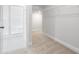 Walk-in closet featuring wire shelving and neutral carpet leading to an en-suite bathroom with a glass-enclosed shower at 2480 Campton Loop, Conway, SC 29527