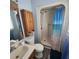 Bathroom with shower and wood vanity at 354 George Washington Trail, Georgetown, SC 29440