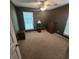 Bright bedroom with carpeted floor, dresser, and window at 354 George Washington Trail, Georgetown, SC 29440