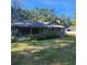 Gray house with a covered porch and green lawn at 354 George Washington Trail, Georgetown, SC 29440