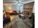 Spacious living room with brick fireplace and wood floors at 354 George Washington Trail, Georgetown, SC 29440