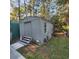 Gray storage shed with double doors and window at 354 George Washington Trail, Georgetown, SC 29440