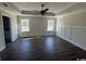 Large main bedroom with dark hardwood floors and wainscoting at 4646 Quiet Ave., Conway, SC 29527